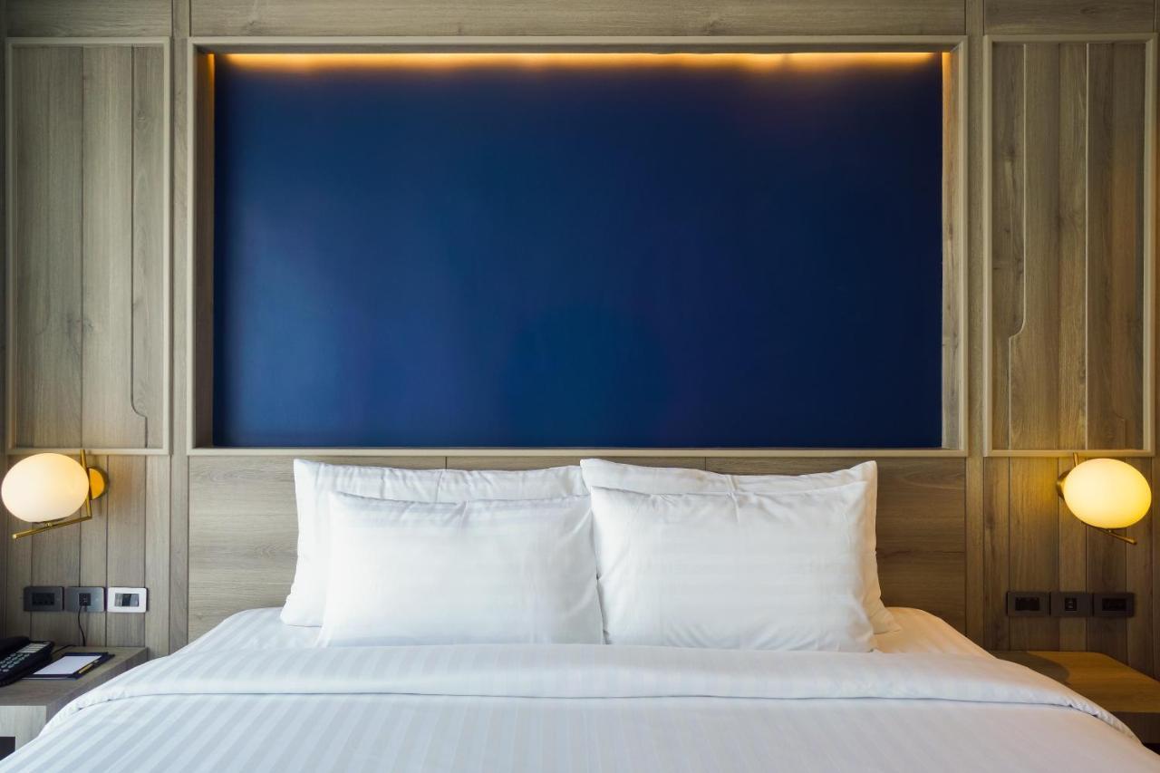 Seabed Grand Hotel Phuket - Sha Extra Plus Екстер'єр фото A bed with two pillows